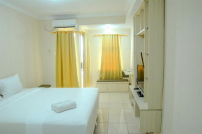 Minimalist Studio Room at Grand Serpong Apartment By Travelio